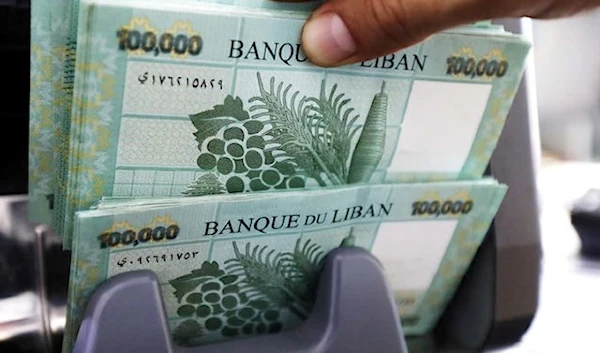 Lebanese pound banknotes are seen at a currency exchange shop in Beirut, Lebanon. (REUTERS)