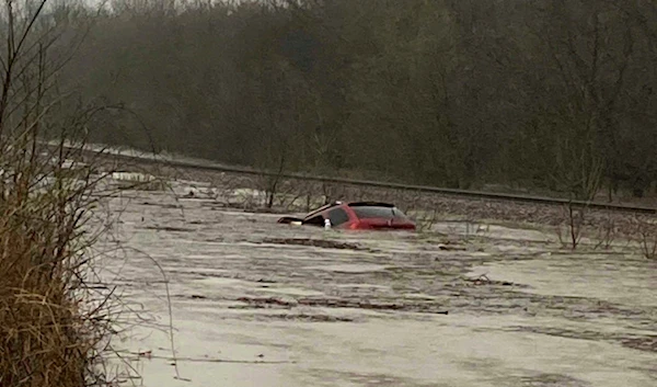 A view of a car diverged in water and flood from the tornado in Mississippi, US on March 24, 2023 (AP)