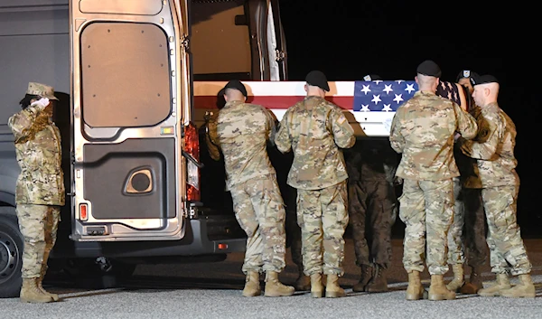 An Army carry team loads into a vehicle a transfer case containing the remains of Spc. Antonio I. Moore, Tuesday, Jan. 28, 2020, at Dover Air Force Base, Delaware after being killed in Deir Ezzor province, Syria.