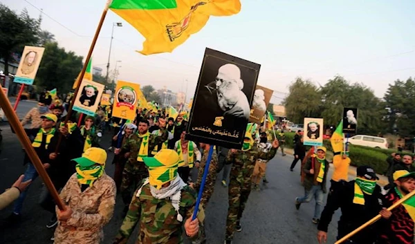 Kataib Hezbollah in Iraq gather ahead of the funeral of martyred commander Abu Mahdi Al-Muhandis, who was martyred in an air strike at Baghdad airport in 2020 (Reuters).