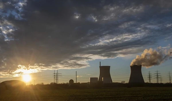 Steam rises from the cooling tower of the nuclear power plant of Gundremmingen, Bavaria, Germany, Friday, Dec. 31, 2021. (AP)