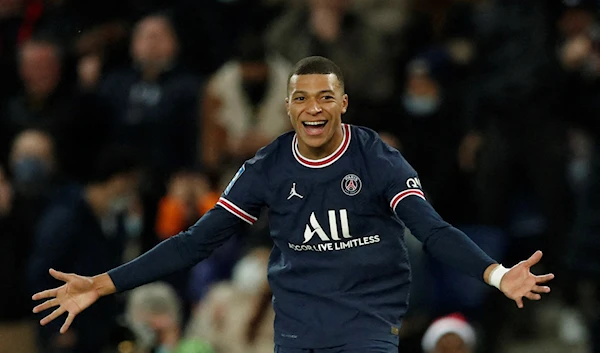 Paris St Germain's Kylian Mbappe celebrates scoring their second goal. Soccer Football - Ligue 1 - Paris St Germain v AS Monaco - Parc des Princes, Paris, France - December 12, 2021 (Reuters)