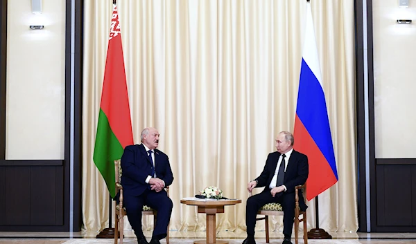 Russian President Vladimir Putin, right, and Belarusian President Alexander Lukashenko talk during their meeting at the Novo-Ogaryovo state residence, outside Moscow, Russia, Friday, Feb. 17, 2023. (AP)