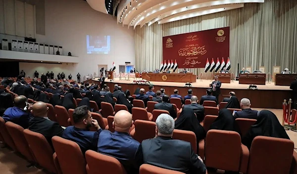 Iraqi lawmakers attend a session of the Iraqi parliament in Baghdad, Iraq on March 26, 2022. (Reuters)