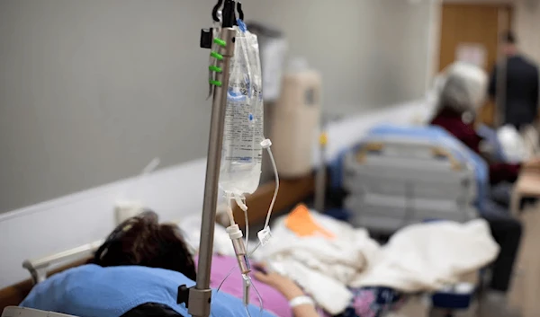 Patients are held in the hallway as St. Mary Medical Center resorts to using tents outside to handle the overflow at its 200 bed hospital during the outbreak of the coronavirus disease in Apple Valley, California, US, January 12, 2021 (AP).