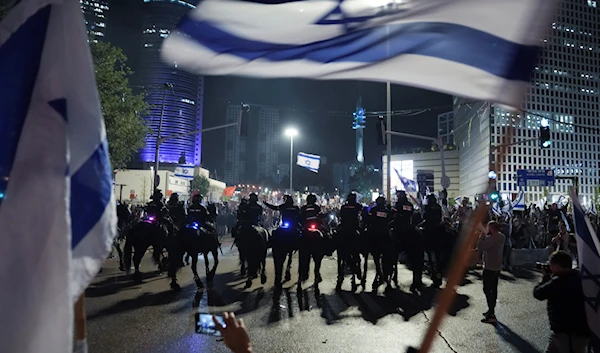 Mounted police confronts anti government protesters in Tel Aviv, Israel, Monday, March 27, 2023. (AP)