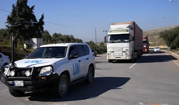 Trucks with aid for Syria follow a UN vehicle at the Turkish crossing point of Cilvegozu, in Reyhanli, southeastern Turkey, Thursday, Feb. 9, 2023. (AP)