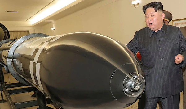 North Korean President Kim Jong Un visits a room displaying what appear to be various types of warheads designed to be mounted on missiles or rocket launchers. on Monday, March 27, 2023, at an undisclosed location in North Korea (KCNA via AP).