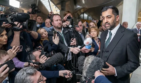 Humza Yousaf speaks to the media after being voted the new First Minister at the Scottish Parliament in Edinburgh, Scotland, Tuesday March 28, 2023. (Jane Barlow/PA via AP)