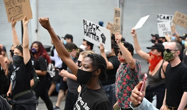 Demonstrators march through the streets of Hollywood, California, on June 2, 2020 (AFP)