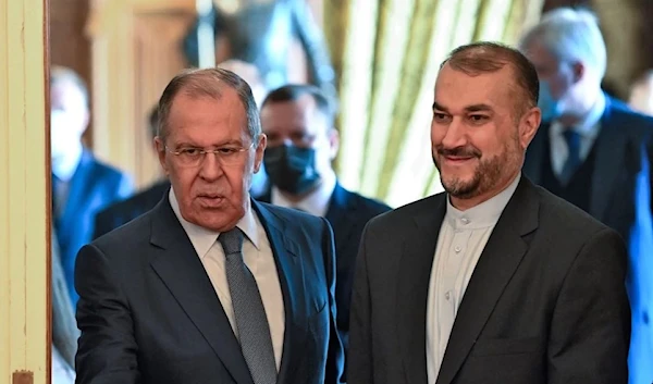 =Russian Foreign Minister Sergey Lavrov welcomes his Iranian counterpart, Hossein Amir-Abdollahian, prior to their meeting in Moscow on Oct. 6, 2021. (AFP)