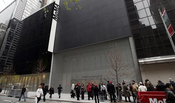 In this Nov. 20, 2004, file photo, people pass in front of the Museum of Modern Art in New York.  (AP)