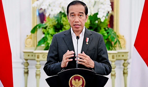 In this photo released by the Press and Media Bureau of the Indonesian Presidential Palace, Indonesian President Joko Widodo delivers his statement at Merdeka Palace in Jakarta, Indonesia, March 28, 2023 (Indonesian Presidential Palace AP)