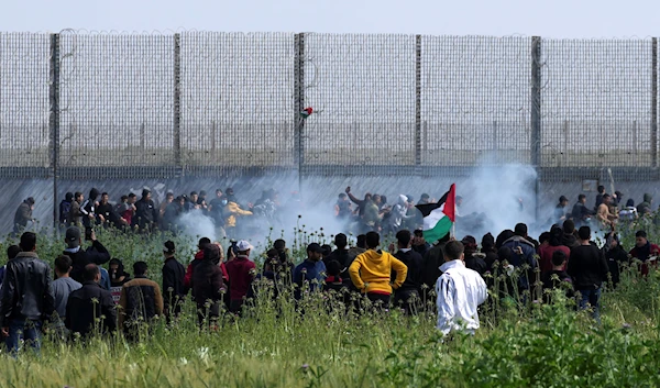 Israeli troops shot teargas at protesters during a demonstration on the commemoration of Palestinian Land Day, east of Gaza City, Palestine,Thursday, March 30, 2023 (AP Photo/Adel Hana)