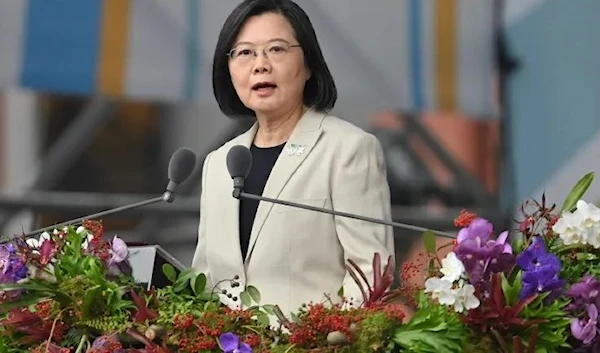 Taiwan's President Tsai Ing-wen speaks outside the presidential office on the island's national day (AFP)