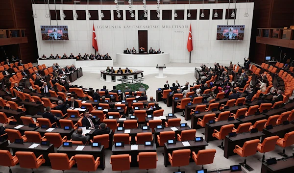 Turkish lawmakers vote in favor of Finland's bid to join NATO, late Thursday, March 30, 2023, at the parliament in Ankara, Turkey (AP).