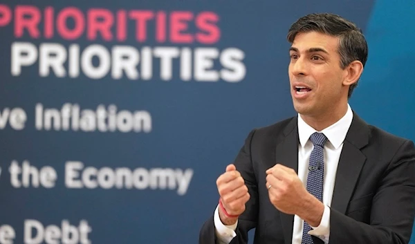 Britain's Prime Minister Rishi Sunak gestures as he attends a Q&A session during a Connect event at a Boxing Club in Chelmsford, Essex, England, Monday, March 27, 2023. (AP)