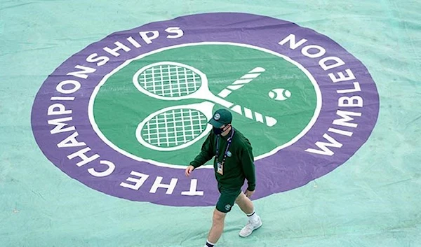 A logo is pictured on a court cover of the 5th day of the 2021 Wimbledon Chanpionships in Wimbledon, southwest London, UK. (AFP)