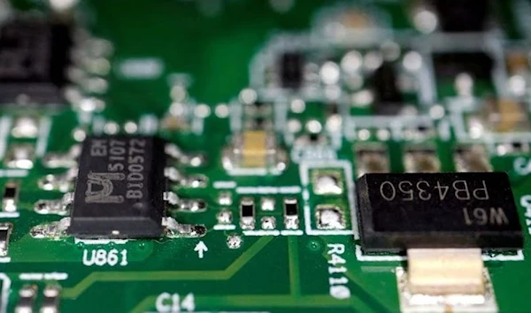 Semiconductor chips are seen on a printed circuit board in this illustration picture taken February 17, 2023. (REUTERS)