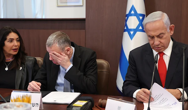 Israeli Prime Minister Benjamin Netanyahu, right, next to Justice Minister Yariv Levin, chairs the weekly cabinet meeting at the Prime Minister's office in occupied Al-Quds, occupied Palestine March 5, 2023 (AP Photo)