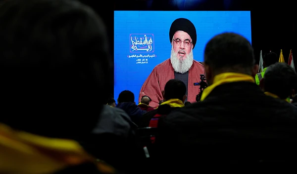 Hezbollah supporters listen to a speech by Hezbollah leader Sayyed Hassan Nasrallah during a rally to mark the "Wounded Resistance Day" in the southern Beirut suburb of Dahiyeh, Lebanon, March 6, 2023 (AP Photo)