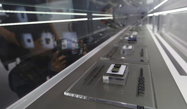 In this April 30, 2019, file photo, Samsung Electronics' microchips are displayed at its store in Seoul, South Korea  (AP Photo/Ahn Young-joon)