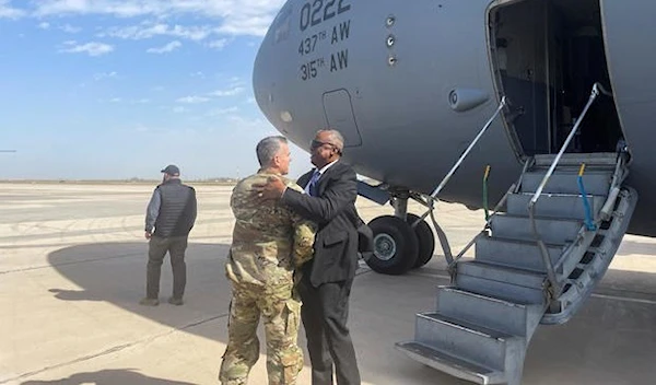 US Defense Secretary Lloyd Austin embraces Major General Matthew McFarlane during his unannounced trip to Baghdad, Iraq, on March 7, 2023 (Reuters).