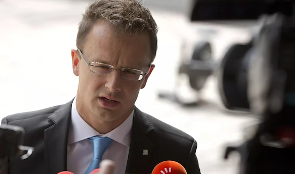 Hungarian Foreign Minister Peter Szijjarto speaking at a press conference (AP)