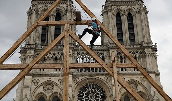 A worker during the restoration process which started in 2020. (AP)