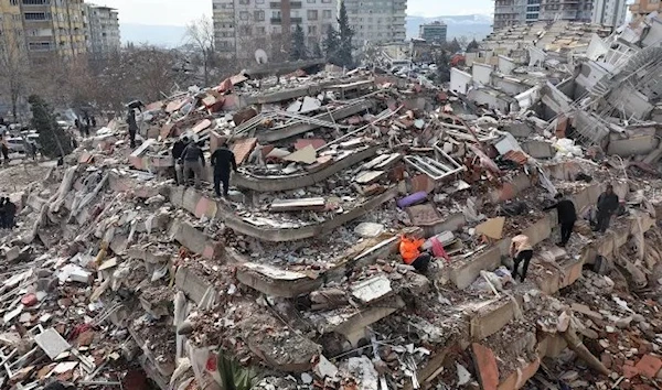 Civilians look for survivors under the rubble of collapsed buildings in Kahramanmaras, close to the quake’s epicenter, the day after a 7.8-magnitude earthquake struck the country’s southeast, on February 7, 2023.(AFP)