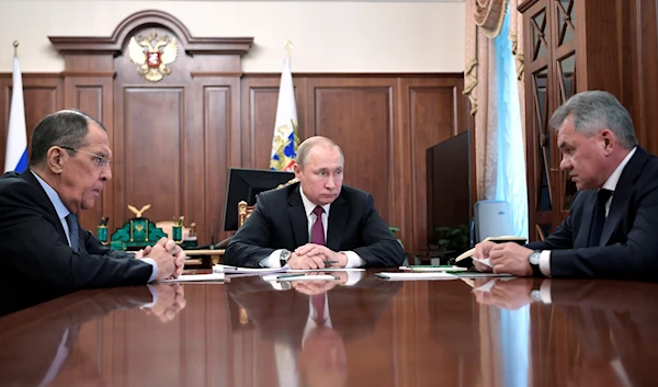 Russian President Vladimir Putin, cente, attends a meeting with Russian Foreign Minister Sergey Lavrov, and Defense Minister Sergey Shoigu in the Kremlin in Moscow, Russia, Saturday, Feb. 2, 2019. (AP)