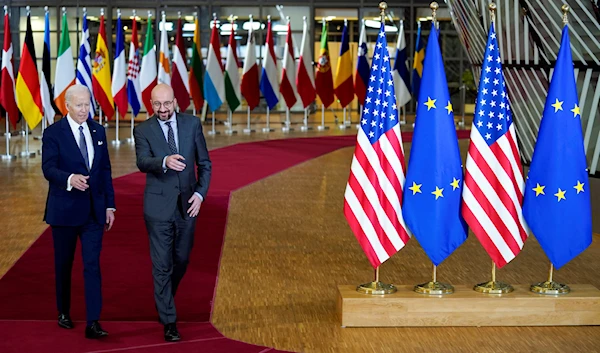 President Joe Biden, left, walks with European Council President Charles Michel during arrival for an EU summit at the European Council building in Brussels, Thursday, March 24, 2022. (AP)