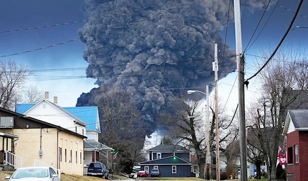 Heavy black smoke rising after the East Palestine, Ohio, train derailment on February 6, 2023 (AP)