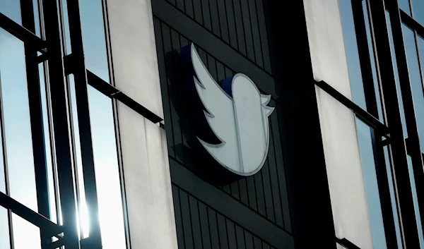 A Twitter logo hangs outside the company's offices in San Francisco, on Dec. 19, 2022 (AP Photo/Jeff Chiu, File)