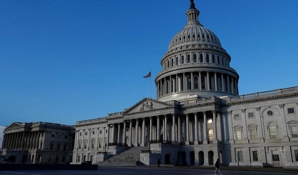 People walk by the U.S. Capitol building in Washington, US, February 8, 2018. (Reuters)