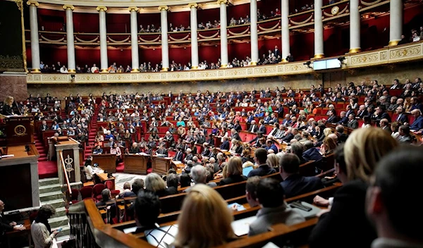 Lawmakers gather at the National Assembly, on Feb. 6, 2023 in Paris (AP Photo/Christophe Ena, File)