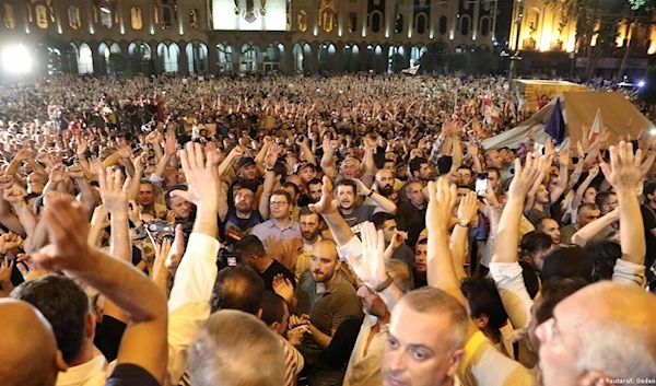 Tens of thousands of people gathered outside Georgia's parliament. (Reuters)