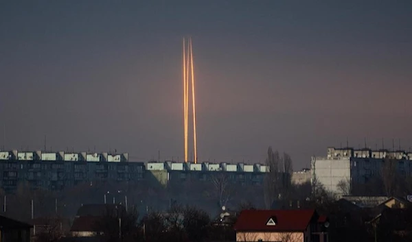 Three Russian rockets that targeted Ukraine launch from Russia's Belgorod region are seen at dawn in Kharkov, Ukraine, March 9, 2023 (AP).