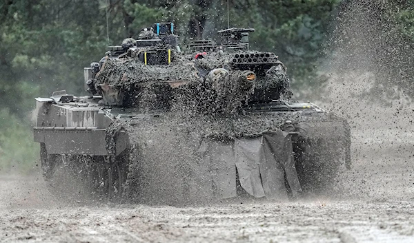 A Leopard 2 tank is seen in action during a visit of German Defense Minister Boris Pistorius at the Bundeswehr tank battalion 203 at the Field Marshal Rommel Barracks in Augustdorf, Germany, Wednesday, Feb. 1, 2023.