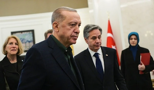 Turkish President Erdogan talks to US Secretary of State Antony Blinken during the meeting at Esenboga airport in Ankara, February 20,2023.