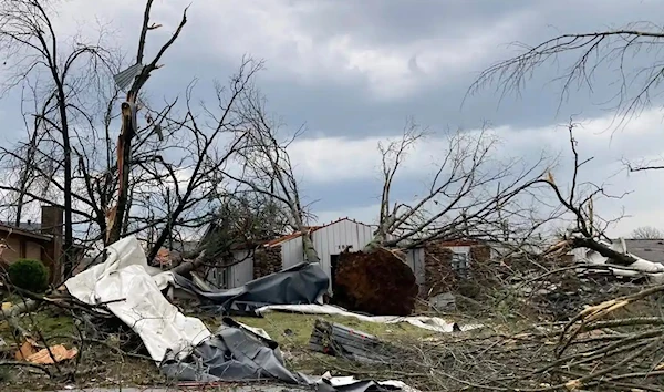 A home is damaged and trees are down after a tornado swept through Little Rock. (AP)