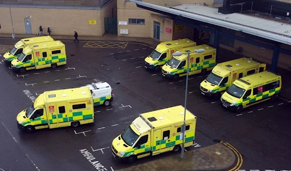 Ambulances are seen parked outside of the Queen's Hospital in Romford, amid the spread of the coronavirus disease (COVID-19) pandemic in London, Britain, January 11, 2022. Picture taken with a drone. (REUTERS)