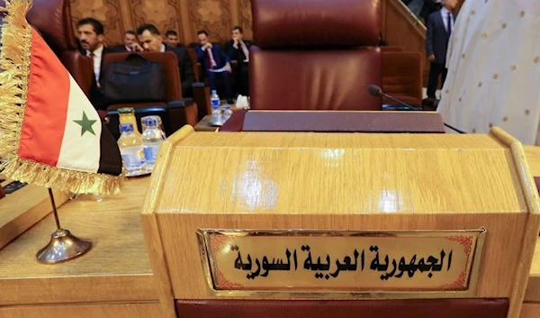 The empty seat of the Syrian delegation during an Arab League meeting to discuss the Syrian crisis in Cairo. (REUTERS)