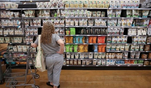 A customer shops in a supermarket as inflation affected consumer prices in New York City, on June 10, 2022. (Reuters)