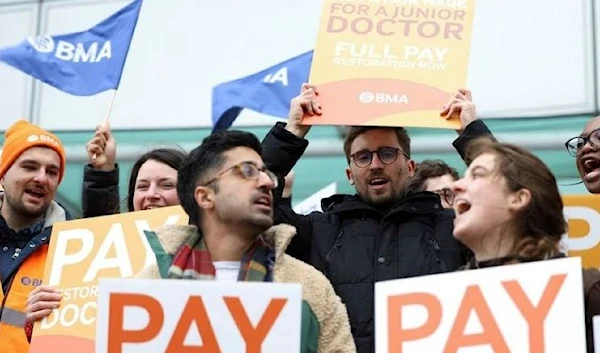 People attend a protest by junior doctors, amid a dispute with the government over pay, in London, Britain, March 13, 2023. (REUTERS)