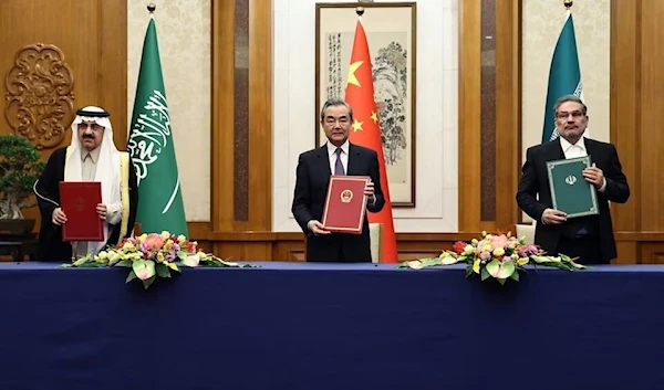 Chinese Office of the Central Foreign Affairs CommiIranian NSC chief Ali Shamkhani and Saudi Minister of State Musaad bin Mohammed Al Aiban in Beijing, China March 10, 2023 (Reuters)