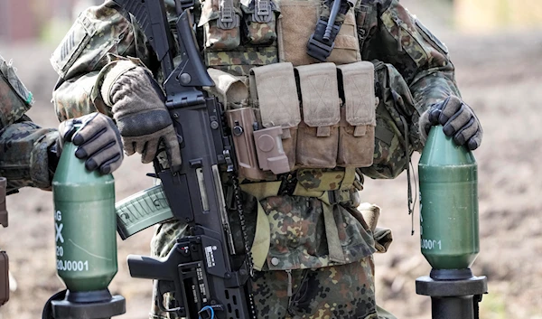 German soldiers stand with guns and bazookas at the army base Field Marshal Rommel Barracks in Augustdorf, Germany, Wednesday, March 30, 2022. (AP)