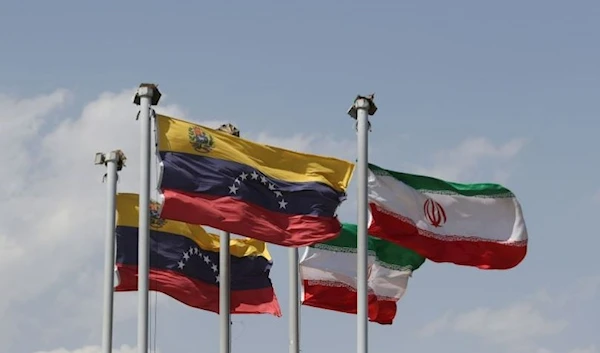 The flags of Iran and Venezuela are seen when Venezuelan President Nicolas Maduro arrives at Mehrabad Airport in Tehran, Iran June 10, 2022. (REUTERS)