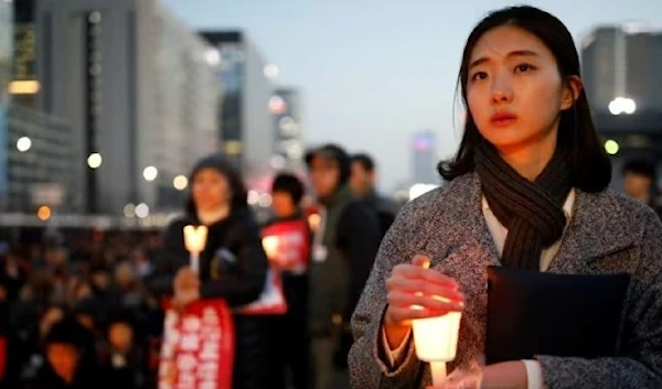 People attend a rally in central Seoul on March 10. (Reuters)