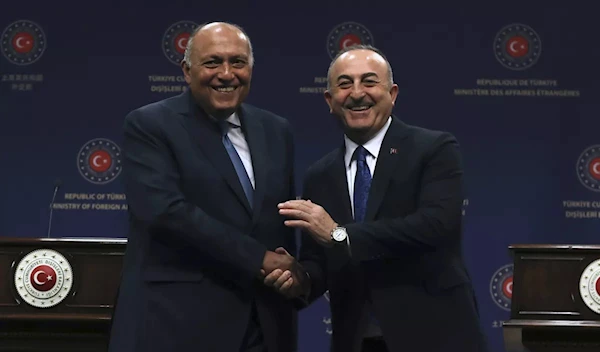 Egyptian FM Sameh Shoukry and Turkish counterpart Mevlut Cavusoglu in Ankara on April 13, 2023 (AP)